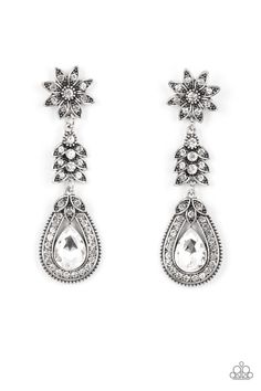 Dotted in dainty white rhinestones, a studded silver flower gives way to a leafy frame that is delicately suspended above a decorative white rhinestone dotted teardrop frame. An oversized teardrop gem seemingly floats inside the center of the lowermost frame, adding iridescent dazzle to the floral fairytale. Due to its prismatic palette, color may vary. Earring attaches to a standard post fitting. Fantasy Earrings, White Earring, Dainty Band, Feeling Pretty, Floral Accessories, Paparazzi Accessories, White Rhinestone, Rhinestone Studs, Paparazzi Jewelry