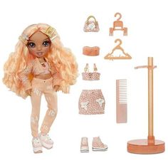 a doll with blonde hair and clothes on display next to a comb, brush, shoelaces and other accessories