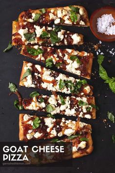 four slices of goat cheese pizza with basil leaves and salt on the side for garnish