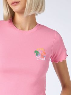 This crewneck tee is crafted from ribbed cotton and adorned with iconic and playful captions. The embroidered Saint Barth logo on the sleeve provides a textured and dimensional touch to this fashionable t-shirt. Woman ribbed cotton t-shirtSnug fitDesigned to hit at the waistPink ribbed cottonCrewneckShort sleevesAprès Beach embroideryRuffled hemsSaint Barth logo signature embroidered on the sleeveComposition: 100% cottonRegular fitModel is 176 cm and wears a size S. Beach Embroidery, Zegna Shoes, Saint Barth, Pleats Please Issey Miyake, Marine Serre, Sneaker Wedge, Issey Miyake, Luxury Accessories, Style Icon