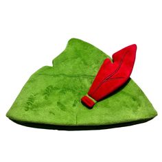 a green hat with a red object on it's head and one piece of fabric in the shape of a leaf