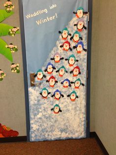 a door decorated with penguins and snow flakes