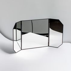 a mirror sitting on top of a white table