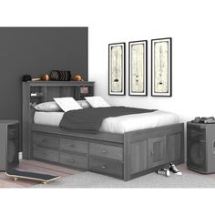 there is a bed with drawers and a skateboard on the floor