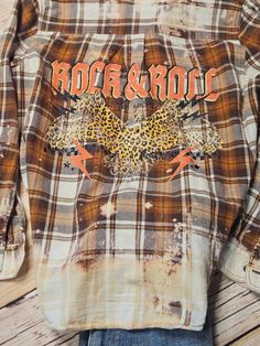 a shirt with the words rock and roll on it