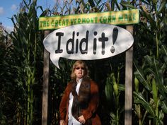 a person standing under a sign that says i did it