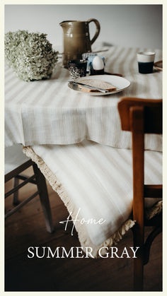 an image of a table setting with the words home summer gray written in white on it