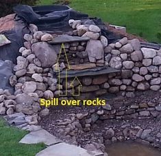 an outdoor fire pit made out of rocks