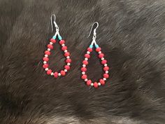 Authentic Beautiful Navajo Zuni oversized hoop earrings with Red Coral and Sterling Silver balls.  Handcrafted by Navajo Artist Harriet Crosby Great for a Gift ❤️ Earrings are 2.5" Hoop Earrings are SO popular right now.. These are perfect for Hoop Lovers! They are large enough to be seen from a far. Perfect hoops to go with Jeans and Boots! Southwestern Style Earrings With Colorful Beads, Bohemian Red Teardrop Jewelry, Southwestern Teardrop Jewelry For Festivals, Southwestern Red Round Jewelry, Southwestern Style Round Red Jewelry, Southwestern Jewelry With Round Beads For Pierced Ears, Red Southwestern Dangle Earrings, Southwestern Red Dangle Earrings, Southwestern Style Red Dangle Earrings