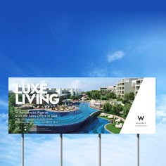 a billboard with the words luxury living on it in front of a blue sky and white clouds