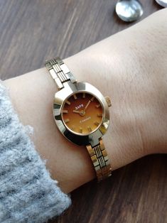 Gilded Watches for Women Small Watch Gift for Her Vintage - Etsy Ukraine Retro Jewelry For Gifts, Retro Jewelry Gift, Yellow Gold Bracelet Strap Watch, Formal Watch With Bracelet Strap, Retro Round Watch As Gift, Retro Round Watch For Gift, Timeless Watch With Gold Clasp As Gift, Retro Gold Watches With Rectangular Dial, Retro Gold Watch With Rectangular Dial