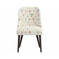 an upholstered chair with wooden legs and a floral pattern on the backrest