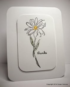 a white plate with a flower drawn on it