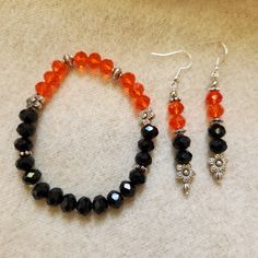 Beautiful beaded bracelet and drop earrings in orange and black. One bracelet and one set of earrings.  Dimensions:  Bracelet - approx 8.5 " Earrings - approx 2.75 " Orange Dangle Jewelry With Black Beads, Braclets Diy, Black Beaded Bracelet, Bracelets Tutorial, Beautiful Beaded Bracelet, Black Beaded Bracelets, Beaded Bracelets Tutorial, Sf Giants, San Lorenzo