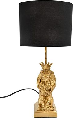 a golden lion lamp with a black shade on it's head and the light turned on