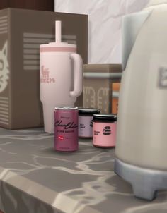 an assortment of items on a table including a blender, canister and cup