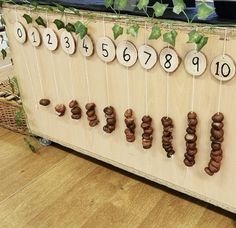 a wooden board with numbers hanging from it's sides