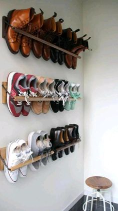 there are many pairs of shoes hanging on the wall