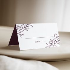 a place card sitting on top of a white plate