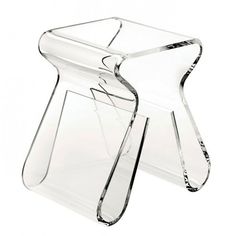 a clear glass vase sitting on top of a table