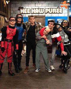 several people in costumes posing for a photo together on the set of tv show big bang