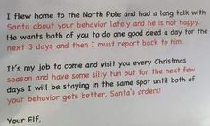 a letter written to santa claus on the side of a white board with red writing