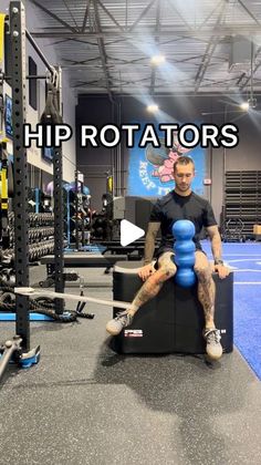 a man sitting on top of a bench in a gym with the words hip rotators above him