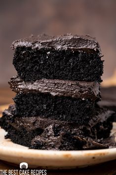 three pieces of chocolate cake stacked on top of each other