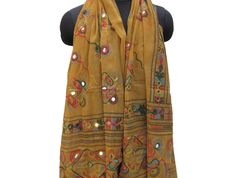 Pattern - embroidered sequin scarf. Ideal for - women/ girls. Occasion - formal or casual. Fabric - cotton. It has an embroidered floral pattern all over. This piece is from the Kutchh area of Gujarat. It is hand-painted and embroidered. Color - On a light yellow background, embroidery is done with different colored threads and mirror sequins. Plastic sequins are used because they are lightweight. Size - 40 x 84 inches(approx). Care - gentle hand wash. For more such scarves please visit- https:/ Traditional Spring Scarves As Gifts, Traditional Spring Scarves For Gifts, Traditional Spring Scarves For Gift, Embroidered Shawl Scarves For Summer, Bohemian Cotton Scarves As Gift, Traditional Cotton Shawl For Spring, Festival Embroidered Cotton Shawl, Bohemian Embroidered Scarves For Festivals, Handmade Cotton Festival Scarves