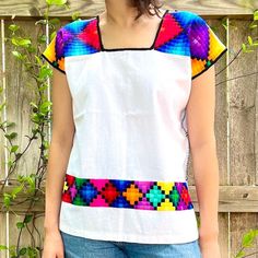 "Modern Geometric Huipil Blouse 100% Made by Ch'ol Artisans in Chiapas, Mexico. The bold geometric designs found in these huipil blouses are like no other! The front of the blouse includes a bold line of embroidery that accentuates all outfits. Mayan Ch'ol artisans from the northern highlands of Chiapas, Mexico, create these ravishing stylized huipil blouses. The intricate geometric design found in this blouse is representative of Ch'ol traditional garments, achieved by embroidering small square Cheap Geometric Embroidered Summer Tops, Hippie Lifestyle, Mexican Embroidery, Ethnic Outfits, Handmade Modern, Embroidery Fashion, Embroidered Blouse, Geometric Designs, Geometric Design