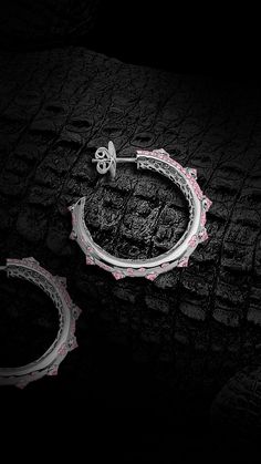 Croc Hoops in 18ct White Gold and Reverse set Sapphire Spikes marching down the tapered tail. The Albino Croc Hoops are paved with round Brilliant Cut pink sapphires and drip with sophistication. Star filigree features as the tails slightly twist. https://www.ohliguer.com/products/the-albino-croc-diamond-hoops-in-platinum OHLIGUER Croc Collection, Saltwater Crocodile, Fine Jewellery, White Metal, Round Brilliant Cut, Pink Sapphire, Round Brilliant, Silver Jewelry, Platinum