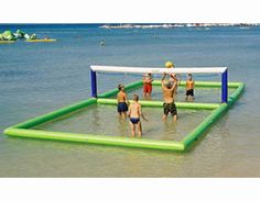 people playing volleyball in the water on an inflatable beach volley ball court,