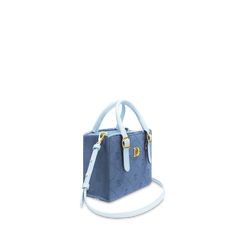 Step into the ultimate expression of casual elegance with the Karin II Atlantis handbag. Inspired by the sun, ocean, and the allure of effortless style, this mini crossbody bag is a fresh addition to the Atlantis collection. Crafted from premium leather and denim, its light blue hue and frayed details make it a standout piece. Designed for versatility, the Karin II can be carried by hand, on the shoulder, or crossbody, offering plenty of space for your essentials without the bulk of zippers or fastenings. Luxury Light Blue Bag With Detachable Strap, Luxury Blue Box Bag For Everyday, Light Blue Leather Shoulder Bag With Top Carry Handle, Light Blue Leather Bag With Top Carry Handle, Elegant Light Blue Satchel With Adjustable Strap, Light Blue Satchel With Detachable Handle, Light Blue Leather Satchel With Top Handle, Trendy Blue Leather Box Bag, Light Blue Satchel With Detachable Handle For Daily Use