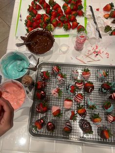 strawberries and other desserts are on the table