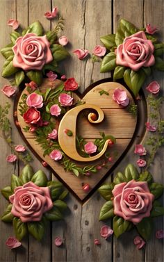 the letter c is surrounded by pink roses and greenery on a wooden background with green leaves