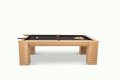 a pool table made out of wooden planks with two cues on the top and one in