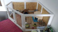 an overhead view of a dollhouse made out of plywood