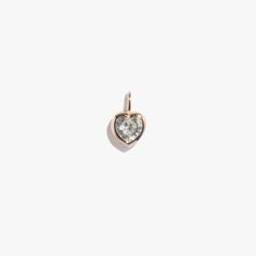 A single heart shaped jewel charm. Magical jeweler quality CZ gem, 2.8 carats, hand set in an open-backed bezel setting and secured with invisible prongs to let in maximum light. Pair with any of our fitting chain necklaces or bracelets. Single pendant only; chain sold separately. Waterproof, more information on jewelry care below. Waterproof but not recommended for daily shower wear due to scratches over time from loofahs or exfoliants. More information on care at bottom of page. Ready-Made use Everyday Cubic Zirconia Heart Charm Jewelry, Classic Heart Shaped Birthstone Jewelry, Classic Heart-shaped Birthstone Jewelry, Everyday Heart Cut Diamond Jewelry, Heart-shaped Jewelry With Bezel Setting For Valentine's Day, Diamond White Heart-shaped Gemstone Jewelry, Classic Heart-shaped Gemstone Jewelry, Heart-shaped Bezel Set Jewelry For Valentine's Day, Everyday Heart Cut Cubic Zirconia Jewelry