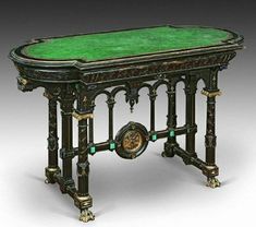 an elaborately decorated table with green glass top