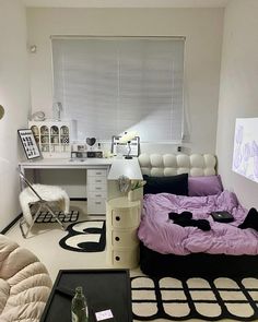 a bed room with a neatly made bed next to a desk