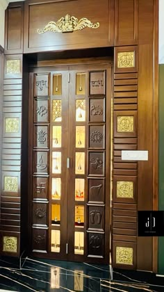 an ornate wooden door with glass inserts