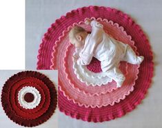 a baby laying on top of a crocheted rug next to a round object