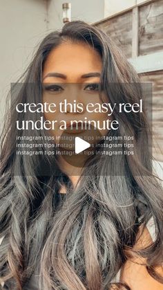 a woman with long grey hair is looking at the camera