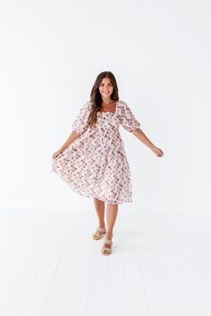 Features Square neck Balloon sleeves Empire waist Pockets Floral print midi dress 100% Polyester Size + Fit Small 0-4, Medium 4-8, Large 8-12, X-Large 12-16, 2X 16-20, 3X 20-24 Kristin is 5'4" a size 1 and is wearing a small Jaycie is 5'6" a size 18 and is wearing a 2X Measurements taken while laying flat and doubled. Measurements do not take stretch into account. Click here for shoes Size Bust Length Small 32" 42" Medium 34" 42" Large 36" 42" 1X 38" 44" 2X 42" 44" 3X 44" 45" Feminine Lavender Floral Print Midi Dress, Feminine Lavender Midi Dress With Floral Print, Flowy Floral Print Midi Dress With Puff Sleeves, Lavender Knee-length Dress For Garden Party, Chic Purple Puff Sleeve Midi Dress, Modest Flowy Floral Midi Dress, Chic Purple Midi Dress With Puff Sleeves, Spring Knee-length Printed Midi Dress, Spring Printed Knee-length Midi Dress