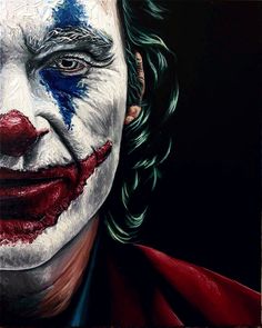 a close up of the face of a person with makeup painted to look like a joker