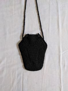 "Channel the spooky season or your inner goth kid with a Handmade Crochet Coffin Bag! Made of super soft yarn and stylish upcycled buttons*, this low-profile shoulder bag is the perfect staple piece for October, Halloween, or year round if you're a fellow weirdo! Measurements:  - Vertical Strap Length From Shoulder = approx. 16.5\" - Bag Width (at smallest point)= approx. 5\" - Bag Depth = approx. 10.5\" *buttons are always small and black but subtle characteristics such as exact size may vary as a result of their upcycled nature" Crochet Goth Bag, Black Crochet Bag, Goth Crochet, Coffin Bag, Learn Crochet, Gothic Bag, Goth Kids, Free Crochet Bag, Crocheting Ideas