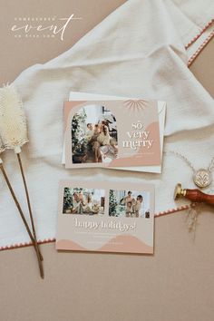 the wedding stationery is laid out next to some flowers and other items on a table