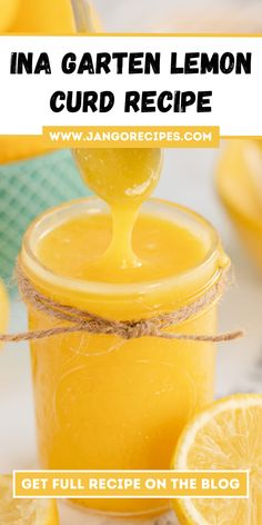 a jar filled with lemon curd next to sliced lemons