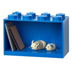 a lego shelf with two small animals in it