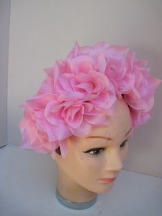 * A versatile headpiece this passionate pink rose fascinator can be worn all year round to Shower Events, Ladies Luncheons, Parties of all sorts, Valentine's Day and any events in between! * The roses are nestled together to form the traditional halo affect and the pieces is well balanced, secure and comfortable to wear. * It has been designed on a wide acrylic headband and will fit any headsize. * Great for a Bridesmaid's headpiece, this can be made in any color desired. Wear it for Halloween, Rose Fascinator, Acrylic Headband, Bridesmaid Headpiece, Tiki Dress, Ladies Luncheon, Mad Hatter Party, Fantasy Theme, Silk Roses, Costume Hats